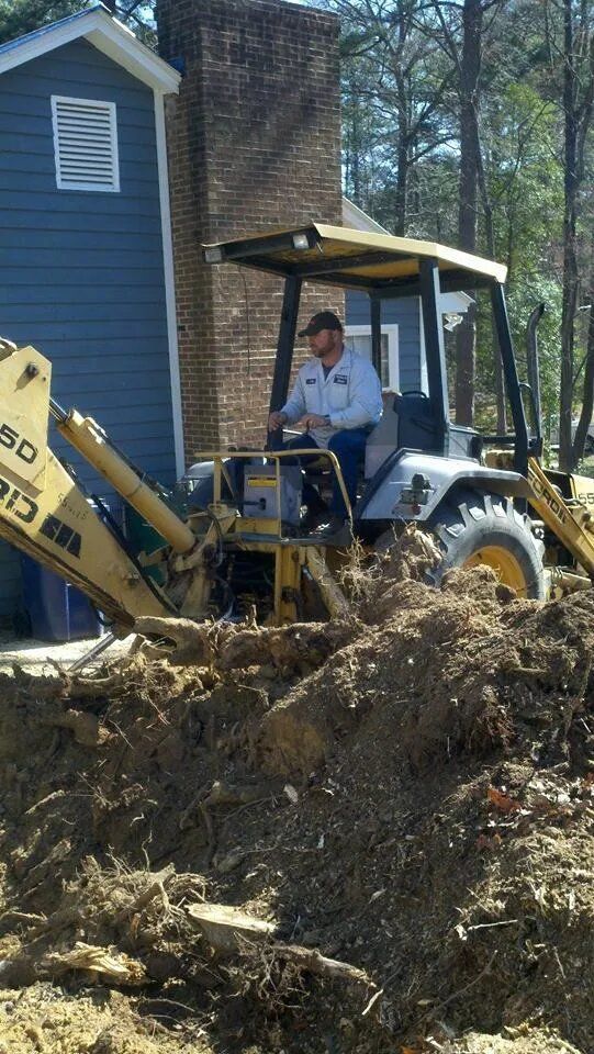 Man is Driving a Bulldozer — Sanford, NC — Phil Stone & Sons Tree Removal