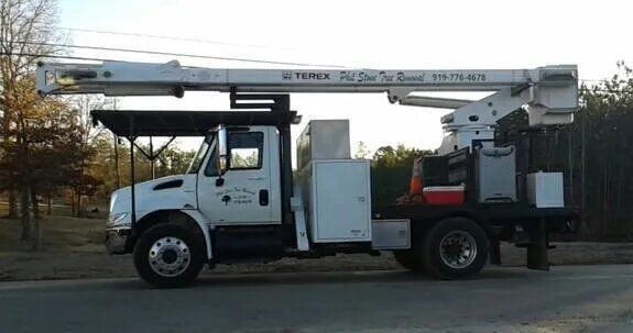 White Truck With a Crane on Top — Sanford, NC — Phil Stone & Sons Tree Removal