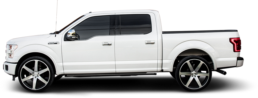 White Ford F-150 pickup truck with large custom wheels, tinted windows, and lowered suspension. | A+ Brakes & Suspension