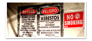 Danger signs: asbestos hazard, no smoking.