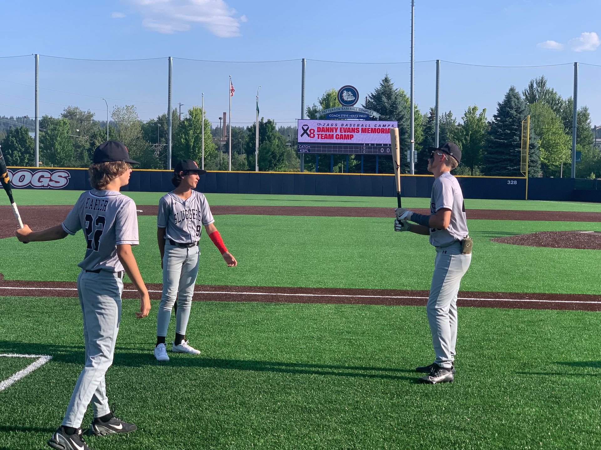 A group of young boys are playing baseball on a field.