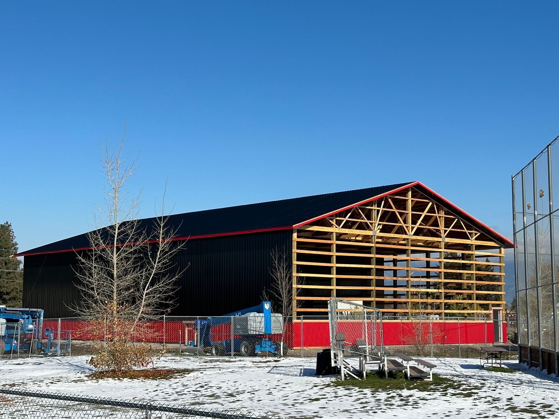 A large building is being built in the snow