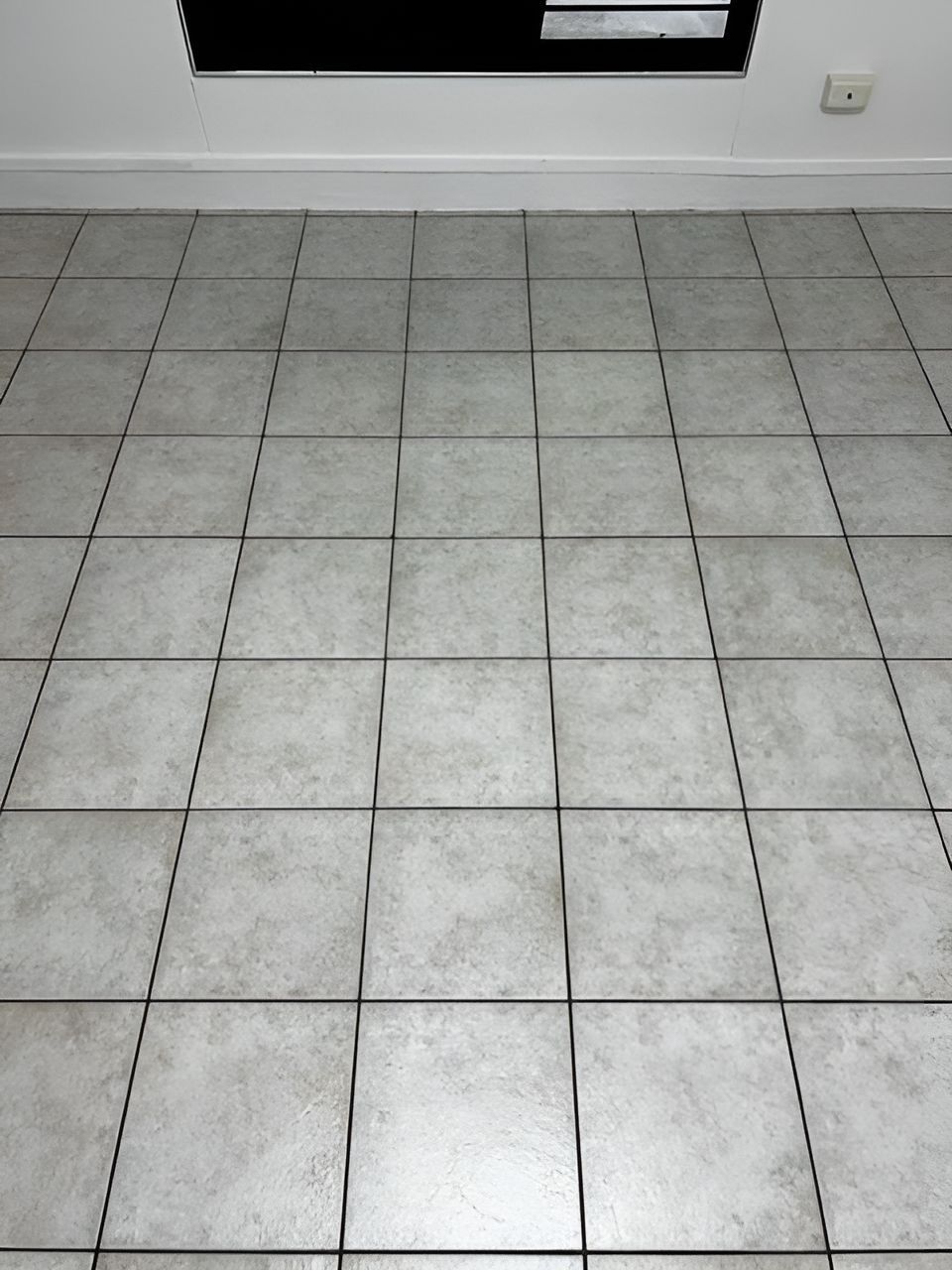 A Tiled Floor With A Window In The Background — Regina's Cleaning Group Pty Ltd In Lee Point, NT