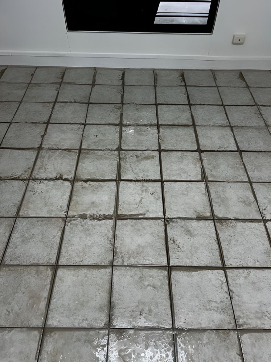 A Close Up Of A Tiled Floor In A Room With A Window — Regina's Cleaning Group Pty Ltd In Lee Point, NT