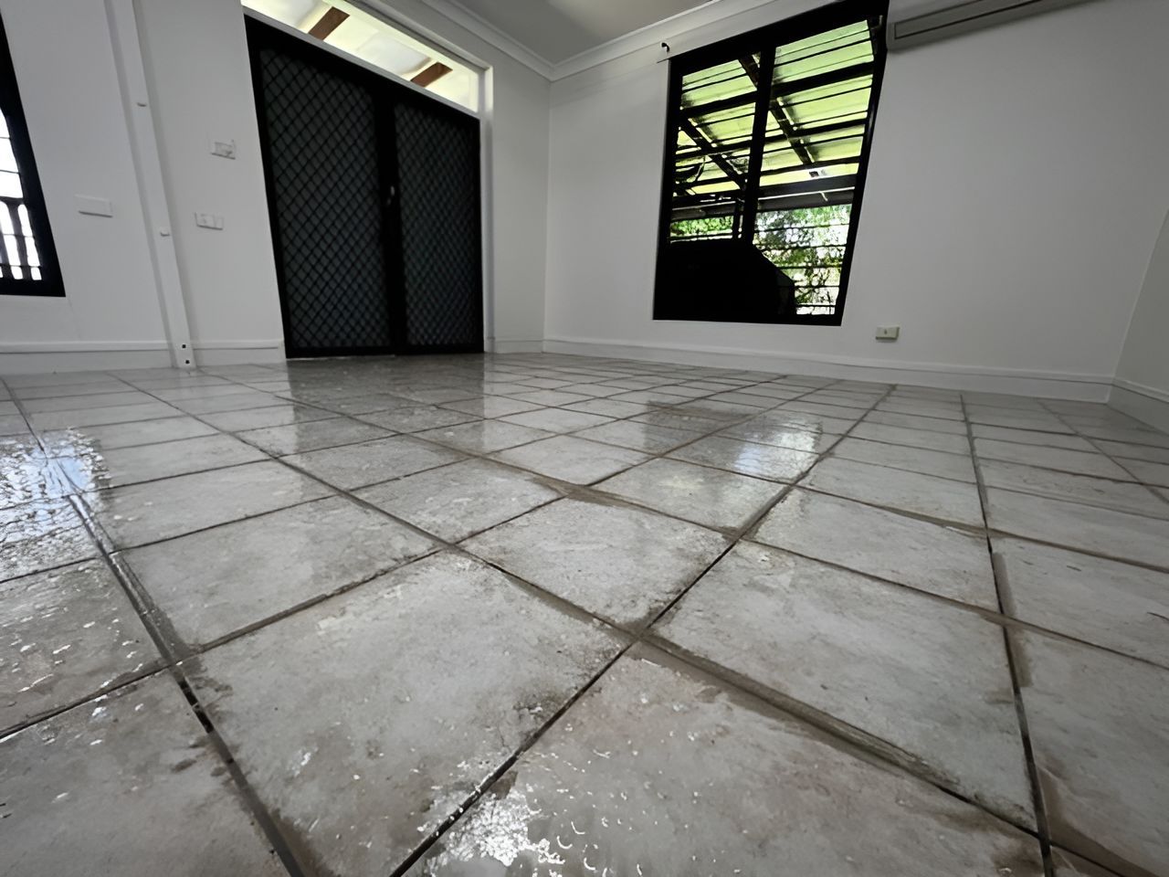 A Room With A Tiled Floor And Two Windows — Regina's Cleaning Group Pty Ltd In Lee Point, NT