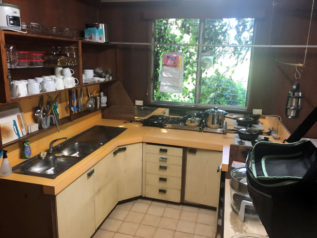 A Kitchen With Two Sinks And A Large Window — Regina's Cleaning Group Pty Ltd In Lee Point, NT