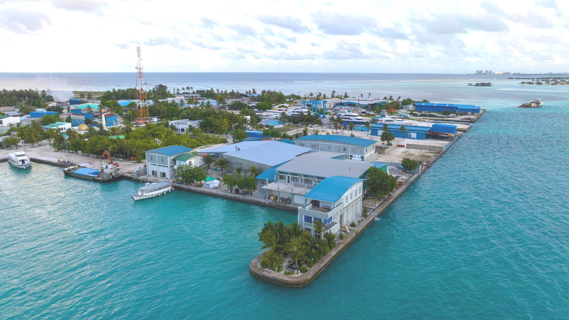 An aerial view of a small island in the middle of the ocean.