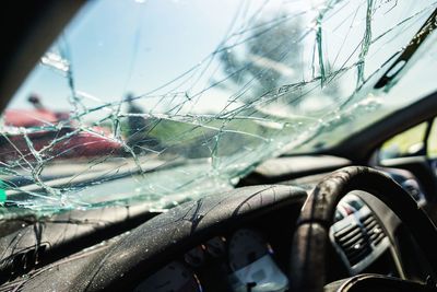Shattered car windshield after an accident Shattered car windshield after an accident
