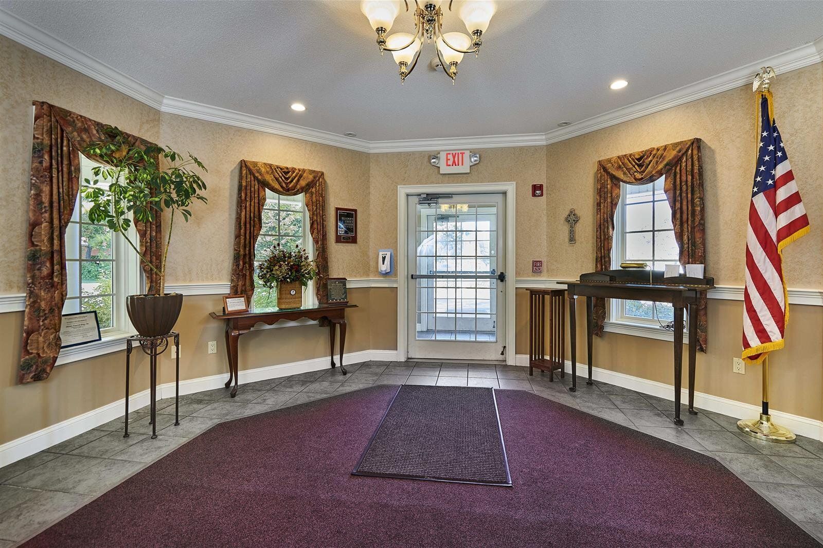 There is an american flag in the middle of the room.