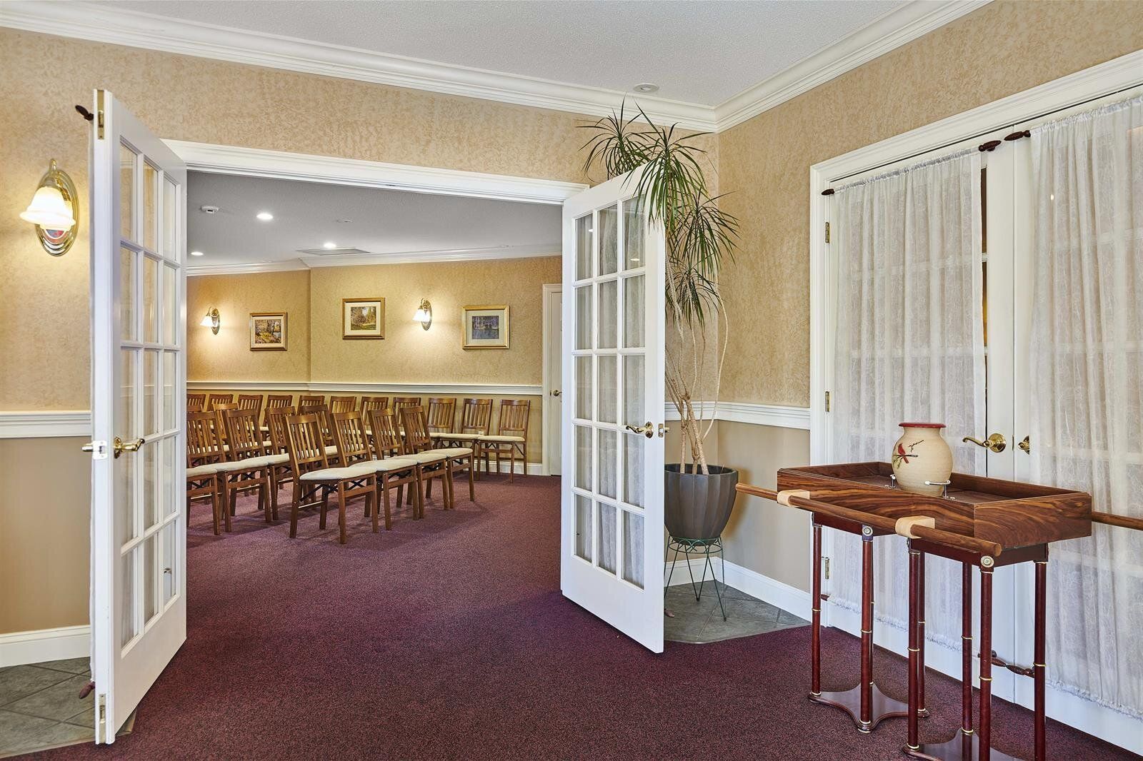 A room with a table and chairs in it