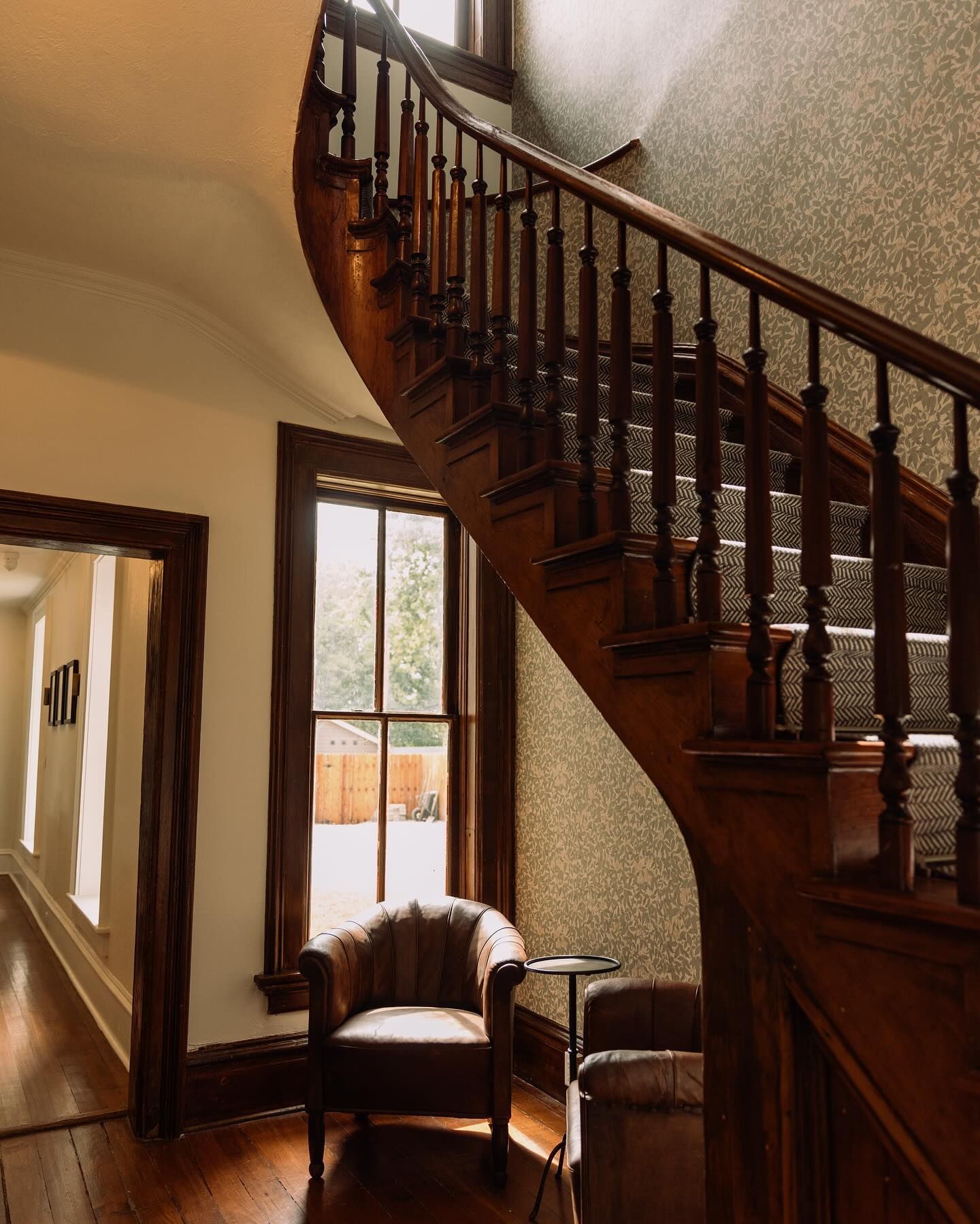 A wooden staircase with a chair in front of it
