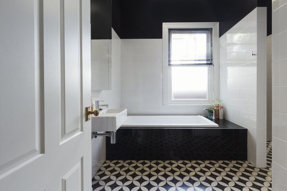 A Bathroom With Black and White Tiles and a Black Ceiling — A1 Maintenance and Building In Old Bar, NSW