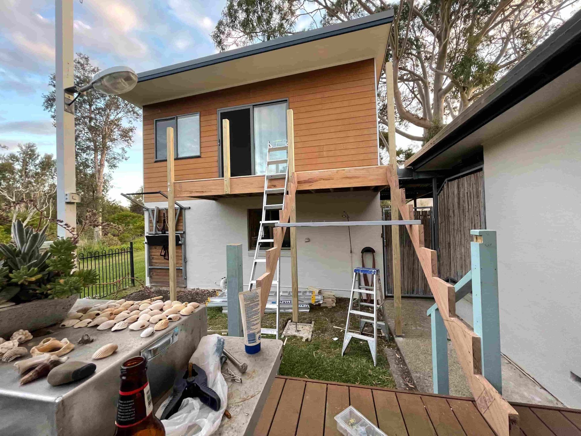 A House is Being Built With a Wooden Deck in Front of It — A1 Maintenance and Building In Old Bar, NSW
