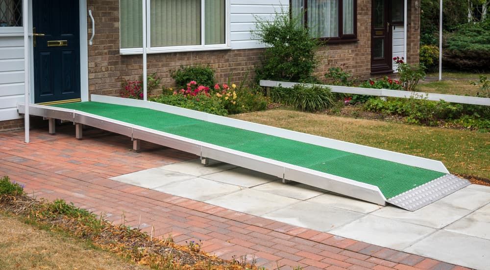 A Wheelchair Ramp is Sitting in Front of a House — A1 Maintenance and Building In Old Bar, NSW