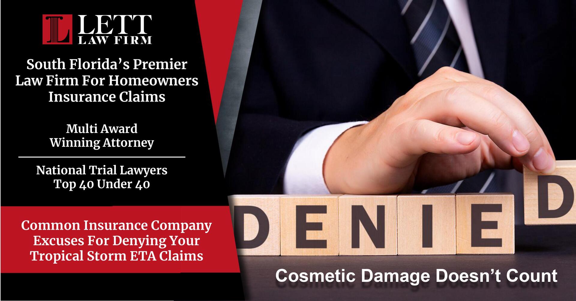 A man in a suit and tie is holding blocks that say denied