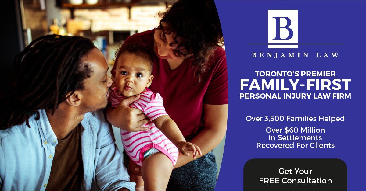 A man is kissing a baby on the cheek while a woman holds a baby.