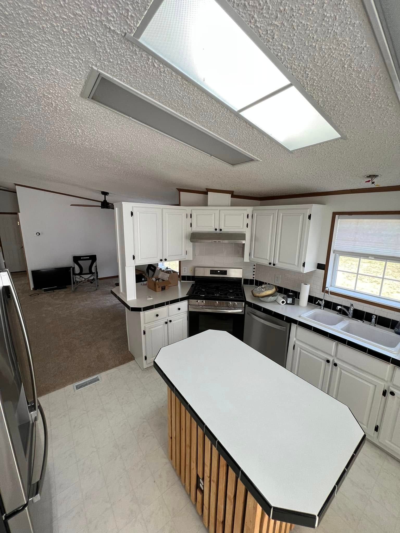 A kitchen with a large island in the middle of it