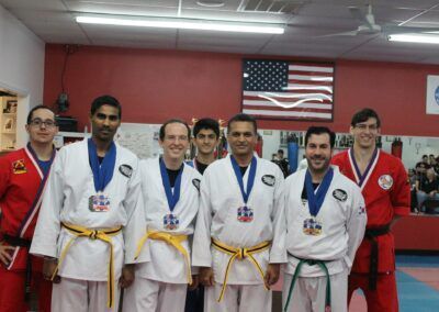 a group of martial arts fighters posing for a picture