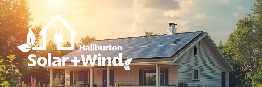 The sun is shining through the windows of a house with solar panels on the roof.