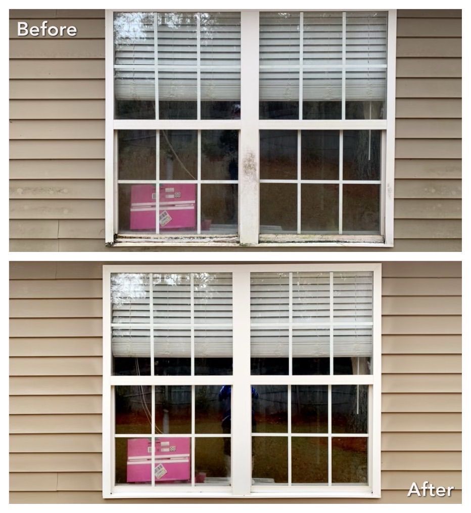 Window before and after cleaning: dirty top half, clean bottom half. Beige siding. White framed window.