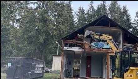 Demolition contractors including concrete driveway or foundation, old house or barn.