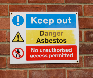 A sign that says keep out danger asbestos no unauthorized access permitted