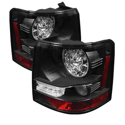 A pair of black tail lights for a range rover sport.