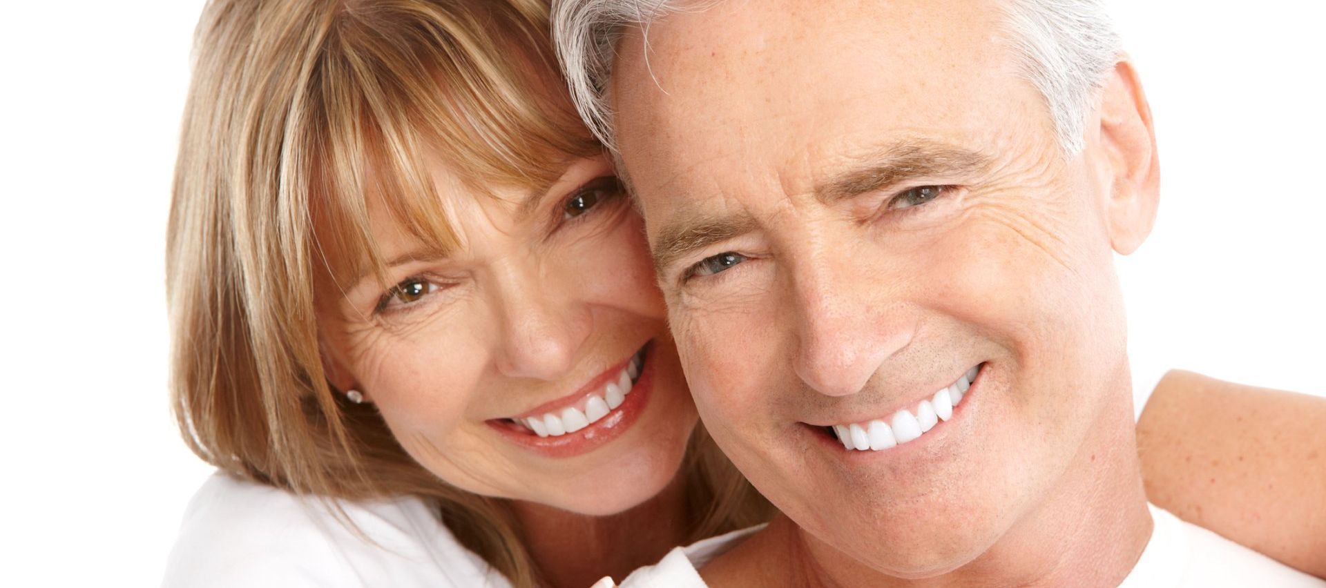 A man and a woman are smiling for the camera.