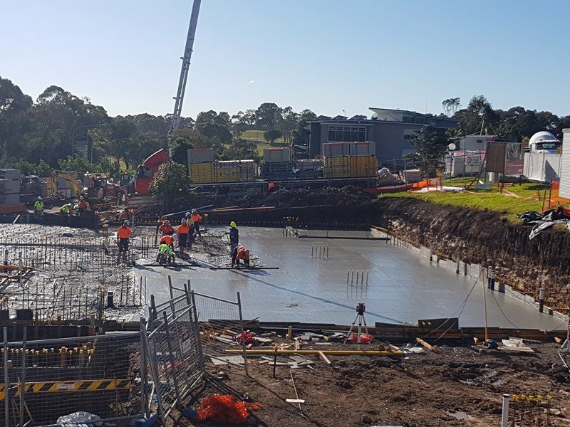 concrete workers on construction site