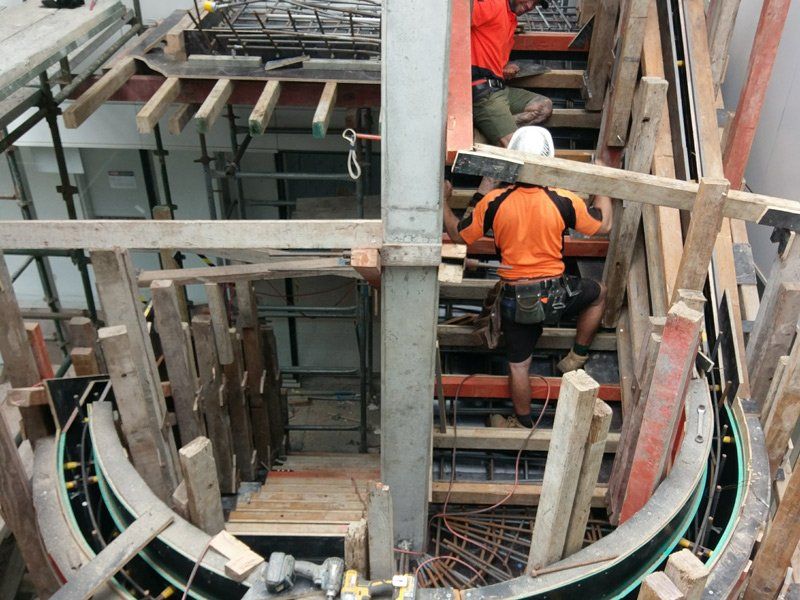 concrete workers constructing staircase