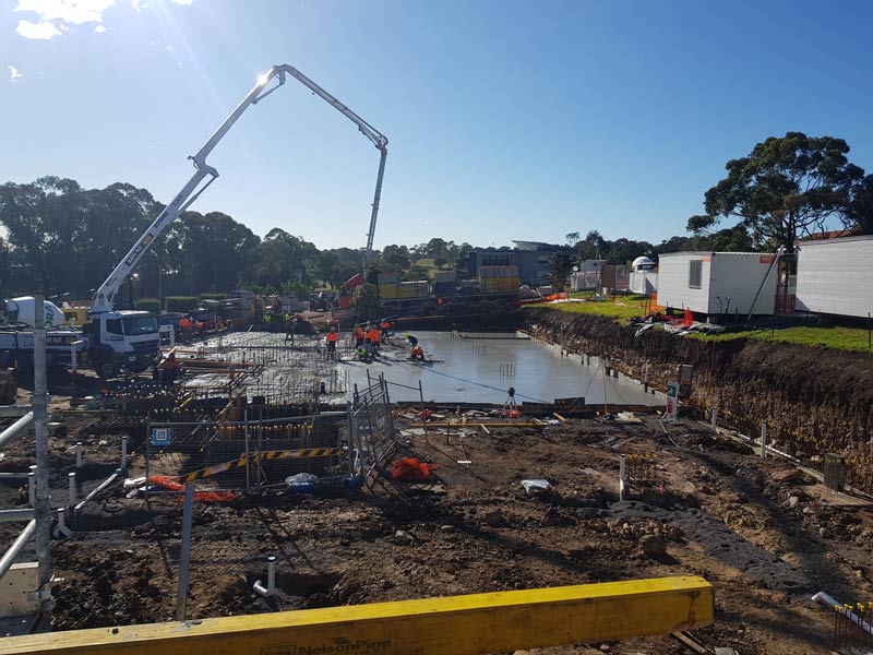 workers pouring concrete