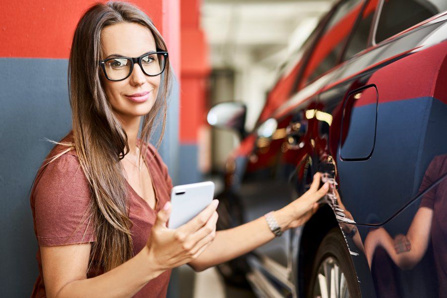 Portrait of Young Woman with Scratched Car — Fort Smith, AR — ASAP Insurance