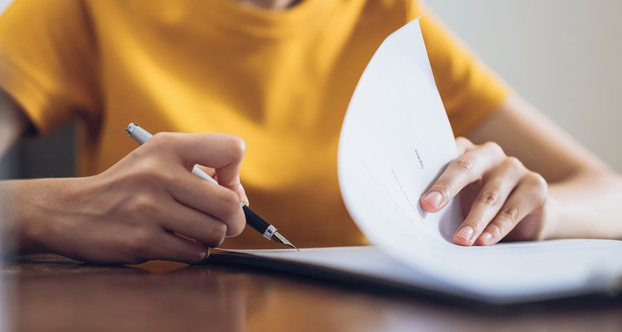 Woman Signing Document — Fort Smith, AR — ASAP Insurance