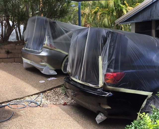 repairing back of 2 cars