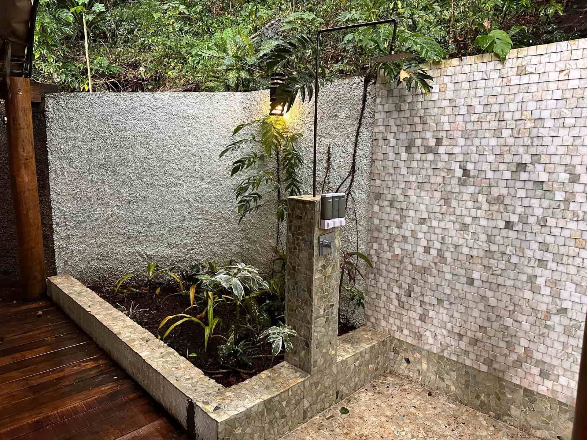 The outdoor shower amid  tropical greenery at Sau Bay Resort Fiji