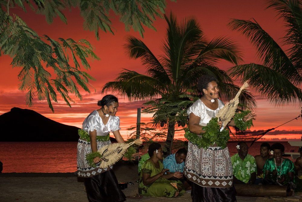 Fijian ladies in traditional dress performing a cultural dance at Volivoli Beach Resort Fiji 