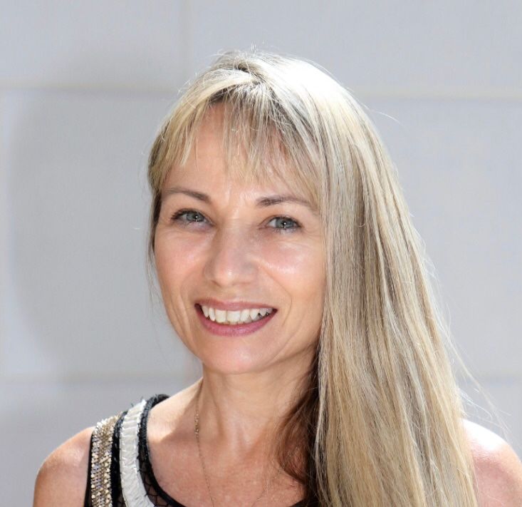 A silhouette of a woman with long hair against a white background