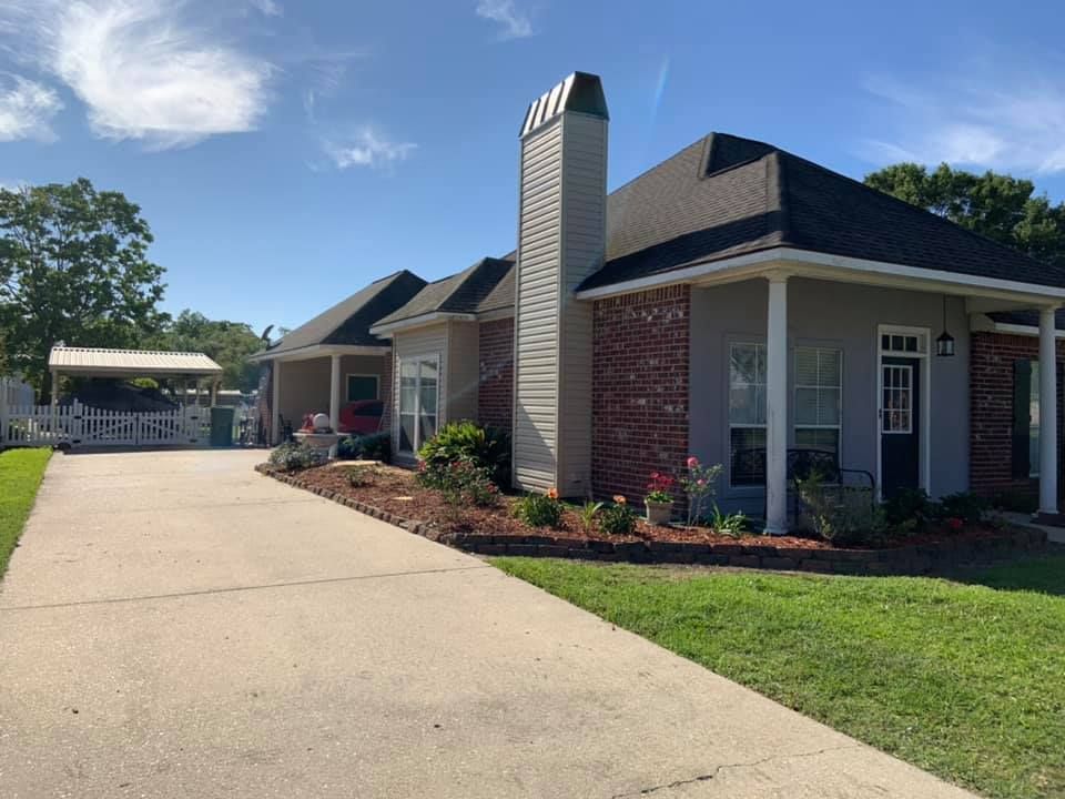 A house with a large chimney on the side of it