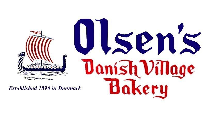Logo for Olsen's Danish Village Bakery across the street.