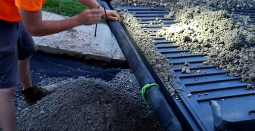 Filling dirt is used on a backyard project