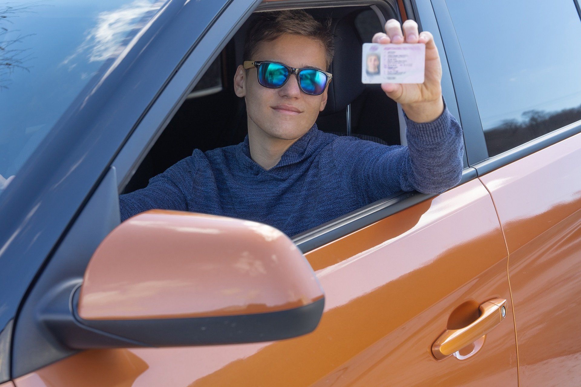 Man holding driver's license