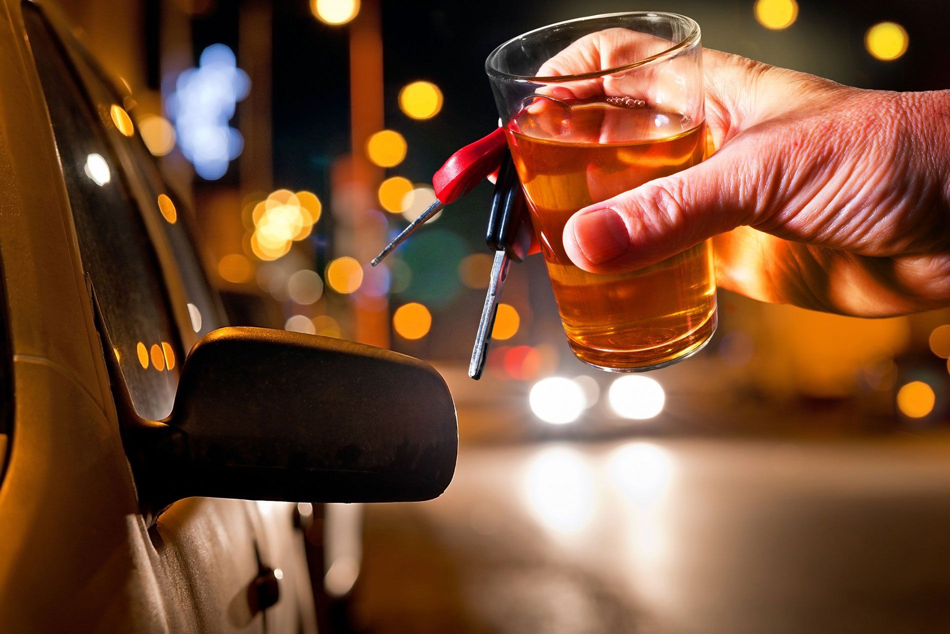 drink and car keys on hand