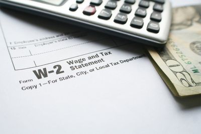 W-2 Tax Form With Calculator & Twenty Dollar Bill — Fort Walton Beach, FL — My Payroll Company
