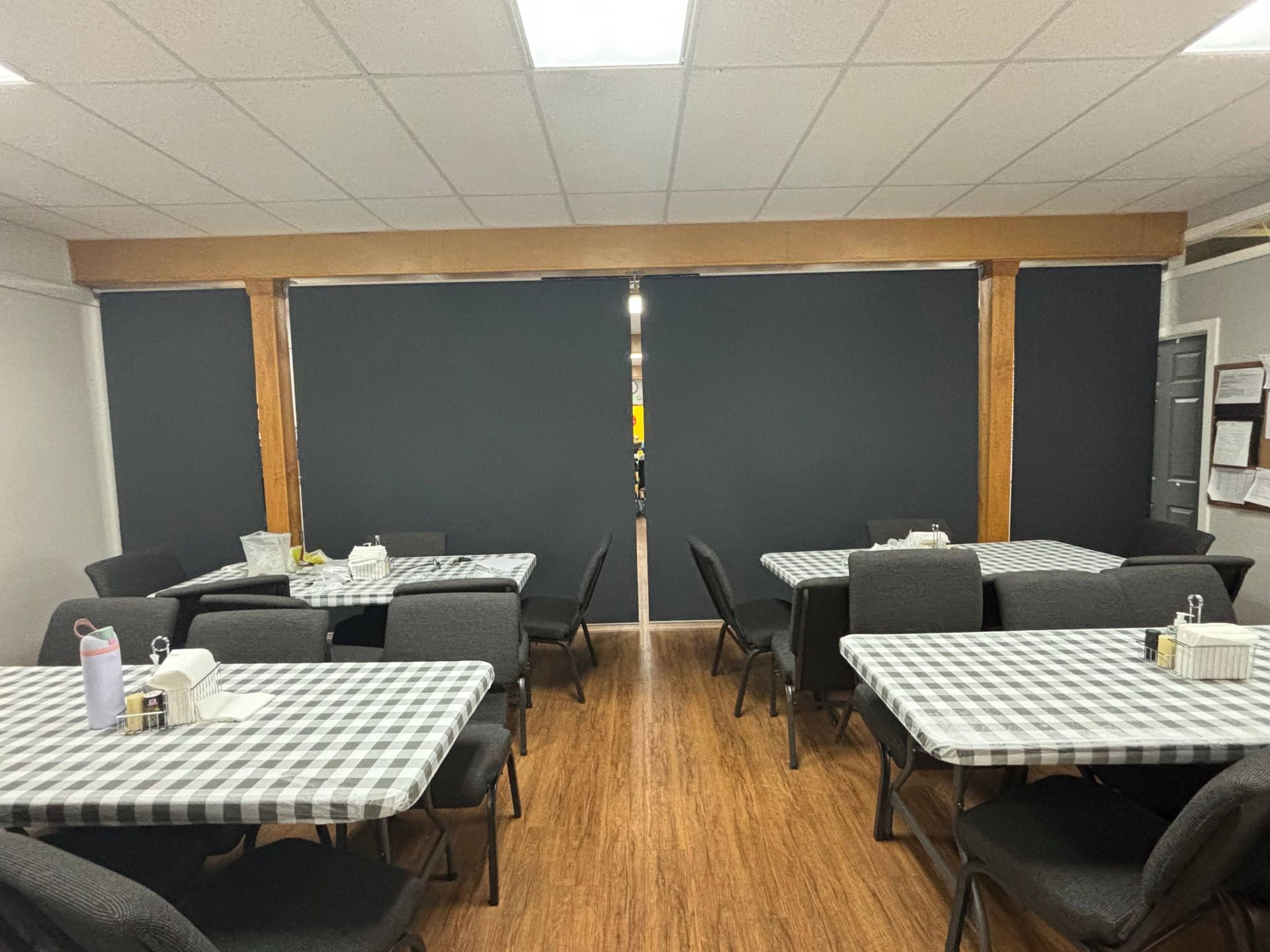 The commercial window shades in the local restaurant, completely lowered, dividing the space near Anchorage, AK