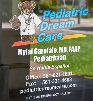 Sign for Pediatric Dream Care, featuring a teddy bear doctor, contact info, and 