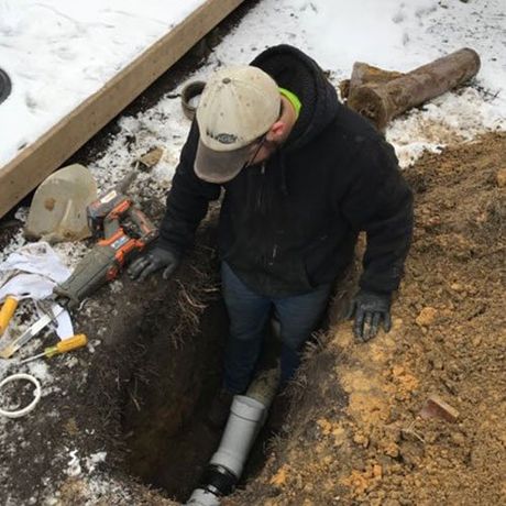 Man Working Home Sewer — Port Huron, MI — Dynamic Drain Services