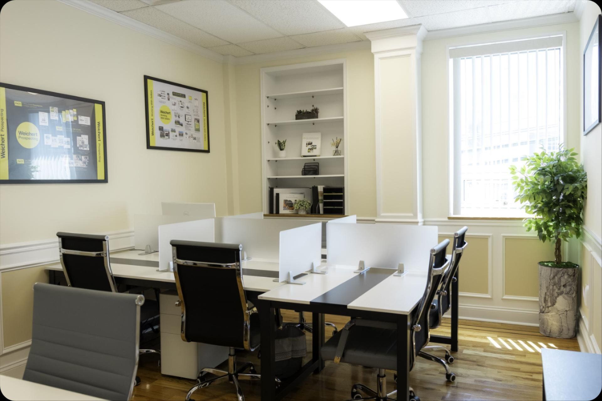 A room with a lot of desks and chairs in it