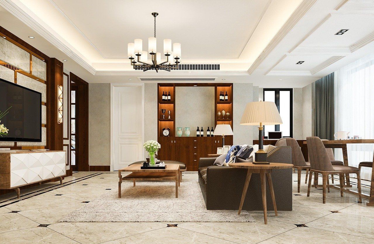 A living room with a couch , table , chairs and a television.