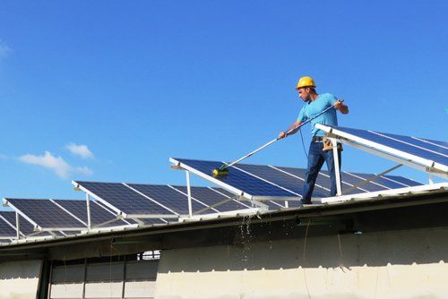 Worker cleaning the solar panels — Peoria, AZ — Pro-Tech Solar Services, LLC