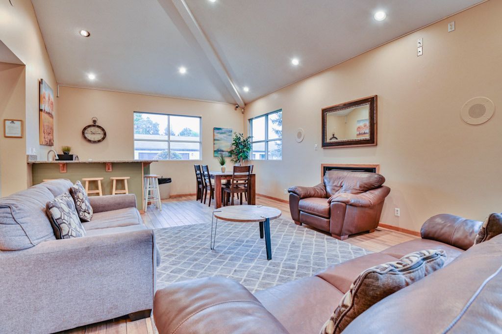A living room filled with furniture and a table.